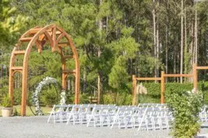 Outdoor garden wedding scene with elegant décor and floral details at Slate & Cypress Estate wedding venue