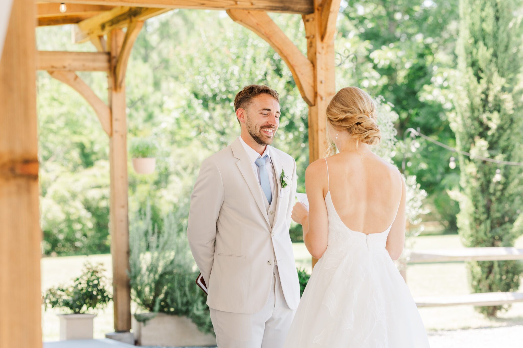 exchanging wedding vows white dress