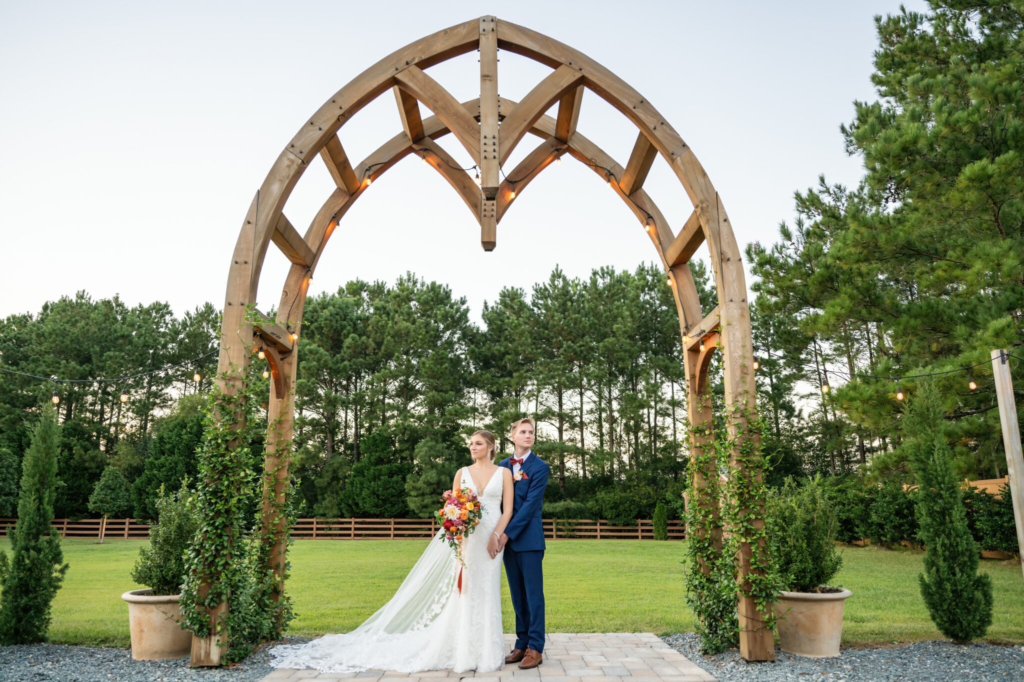 bride and groom wedding arbor
