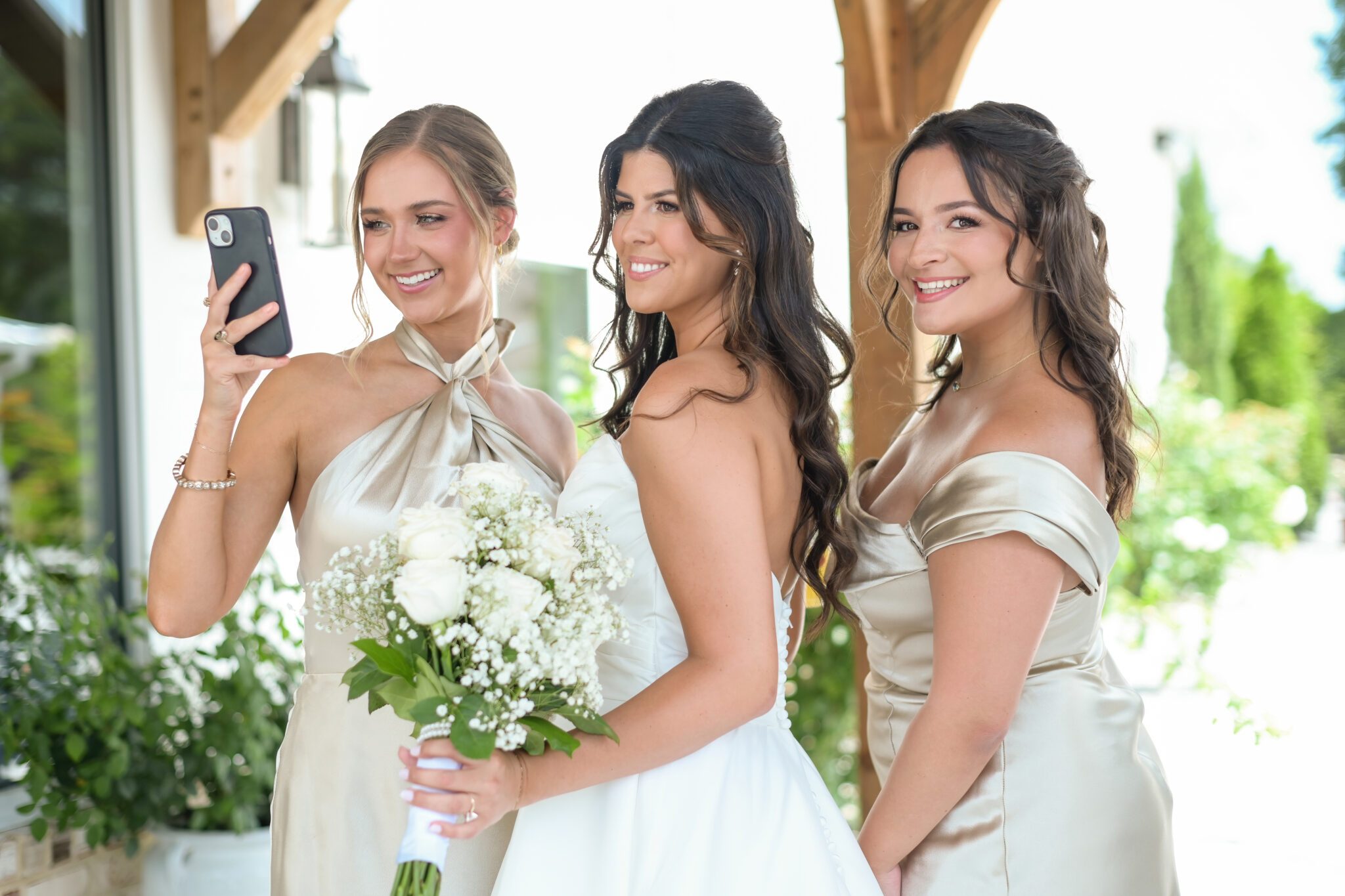 bride and bridesmaids white flowers